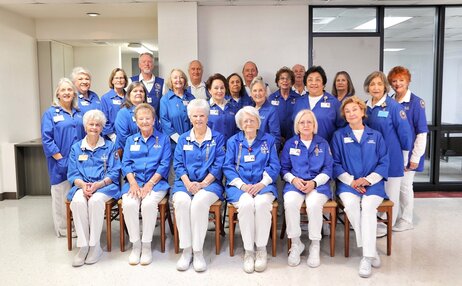 elderly volunteer group smiling